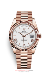 THE OYSTER PERPETUAL DAY-DATE 40 IN 18 CT EVEROSE GOLD WITH A FLUTED BEZEL AND A PRESIDENT BRACELET.