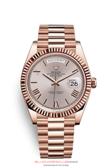 THE OYSTER PERPETUAL DAY-DATE 40 IN 18 CT EVEROSE GOLD WITH A FLUTED BEZEL AND A PRESIDENT BRACELET.